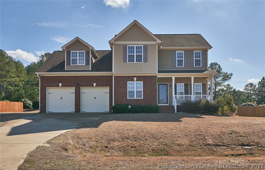 31 Reece Drive Sanford, NC 27332 - Photo 2 of 36 a front view of a house with a yard and garage