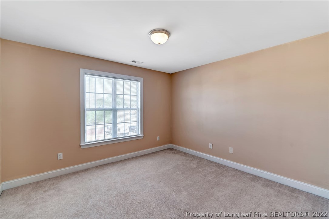31 Reece Drive Sanford, NC 27332 - Photo 22 of 36 an empty room with a window