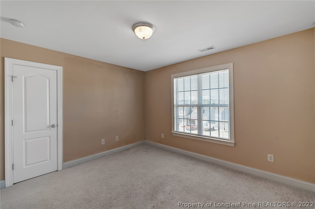 31 Reece Drive Sanford, NC 27332 - Photo 23 of 36 an empty room with a window