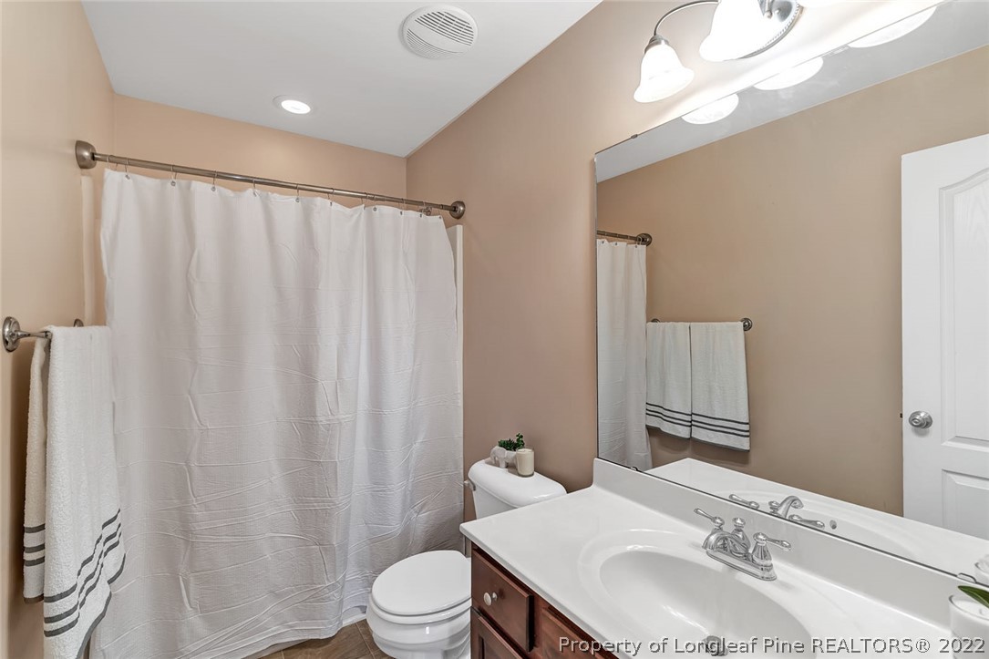 31 Reece Drive Sanford, NC 27332 - Photo 24 of 36 a bathroom with a sink toilet and shower