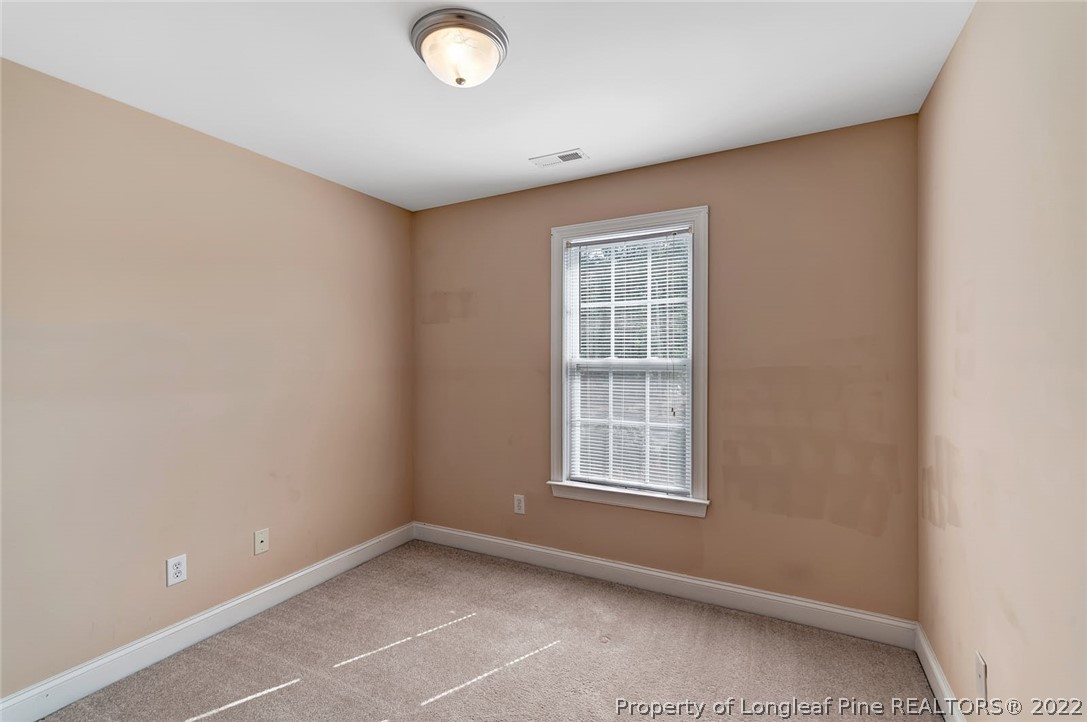 31 Reece Drive Sanford, NC 27332 - Photo 25 of 36 an empty room with windows