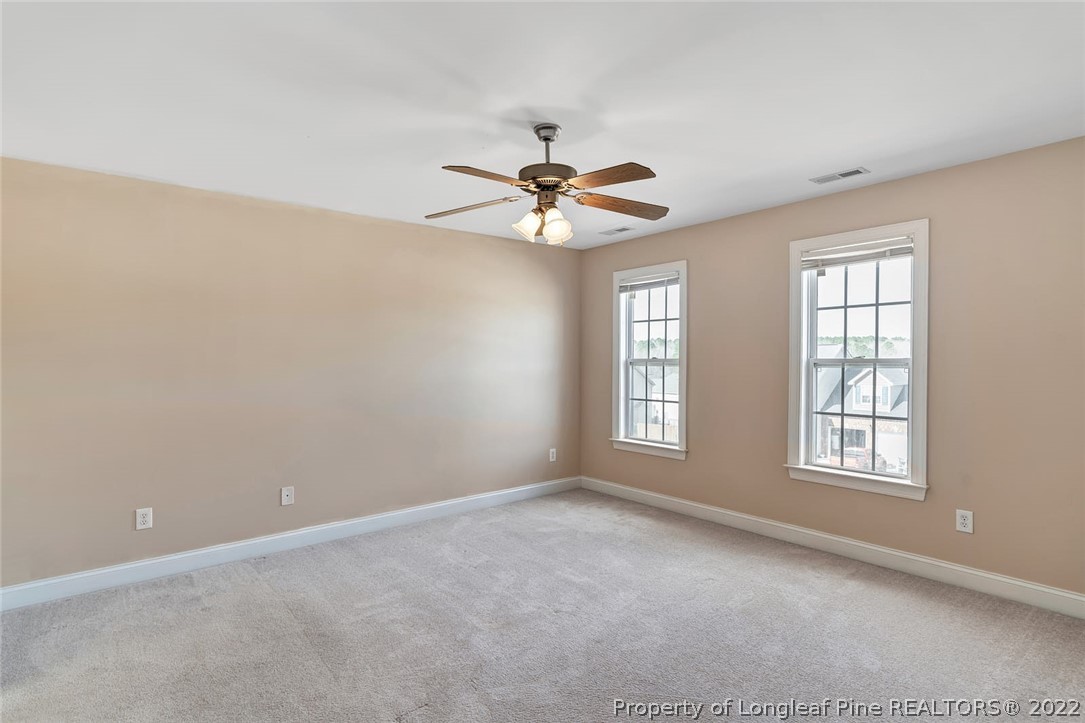 31 Reece Drive Sanford, NC 27332 - Photo 28 of 36 wooden floor in an empty room with a window