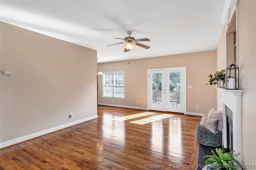 31 Reece Drive Sanford, NC 27332 - Photo 8 of 36 a view of empty room with wooden floor and fan