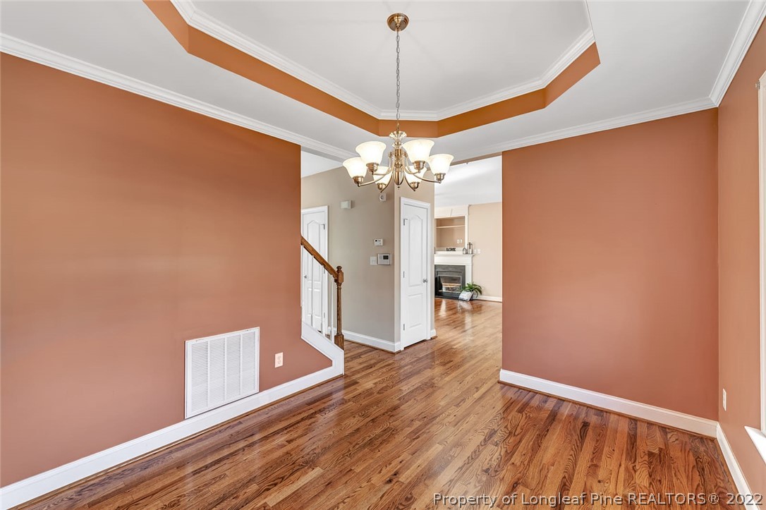 31 Reece Drive Sanford, NC 27332 - Photo 9 of 36 a view of a livingroom with wooden floor and a ceiling fan