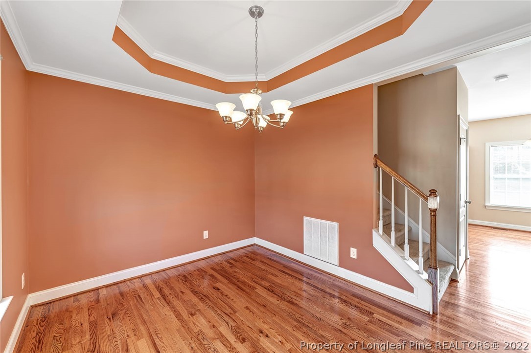 31 Reece Drive Sanford, NC 27332 - Photo 10 of 36 a view of a livingroom with wooden floor and a ceiling fan