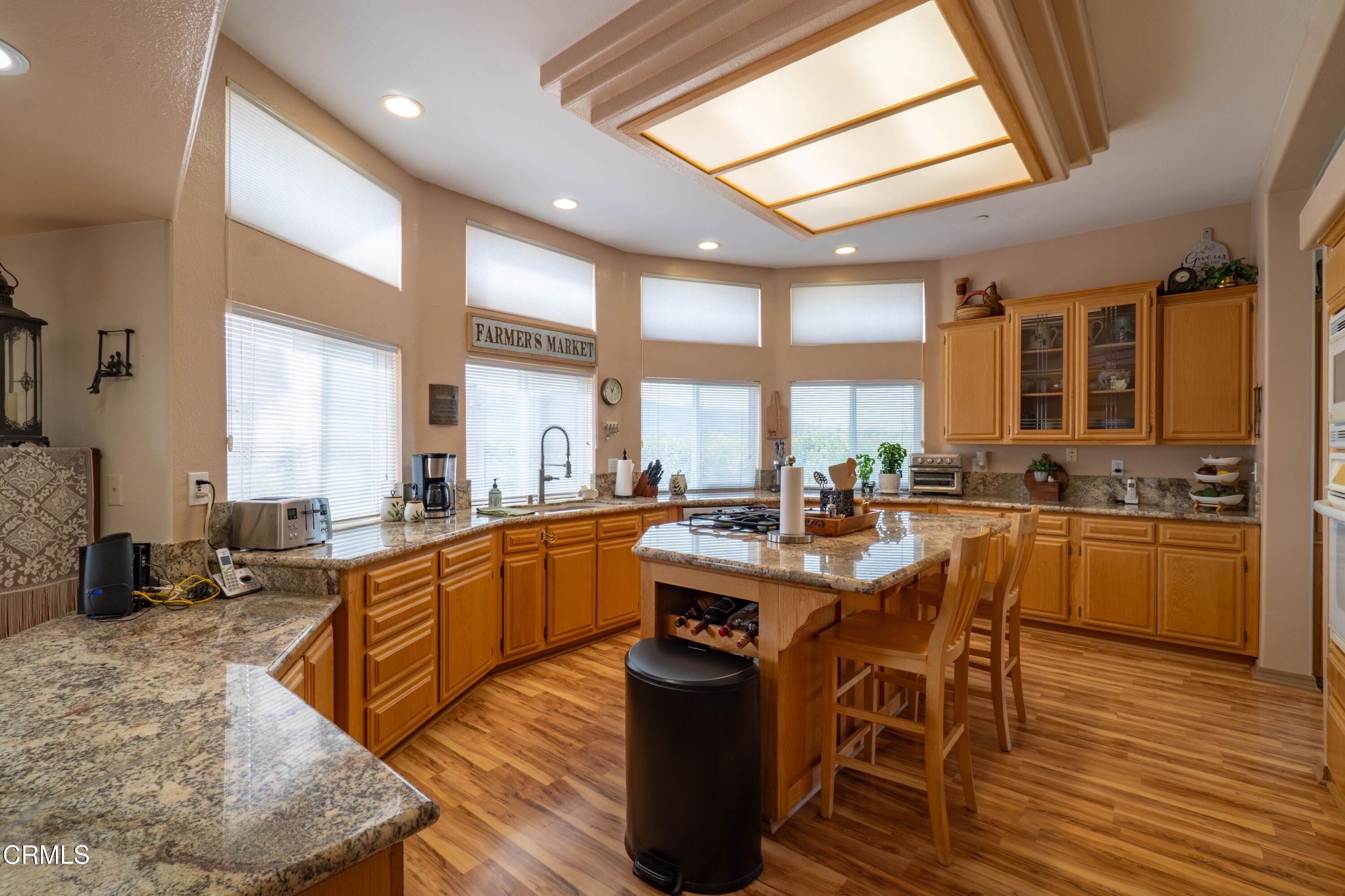 3760 Howe Road Fillmore, CA 93015 - Photo 11 of 32 a large kitchen with lots of counter and chairs