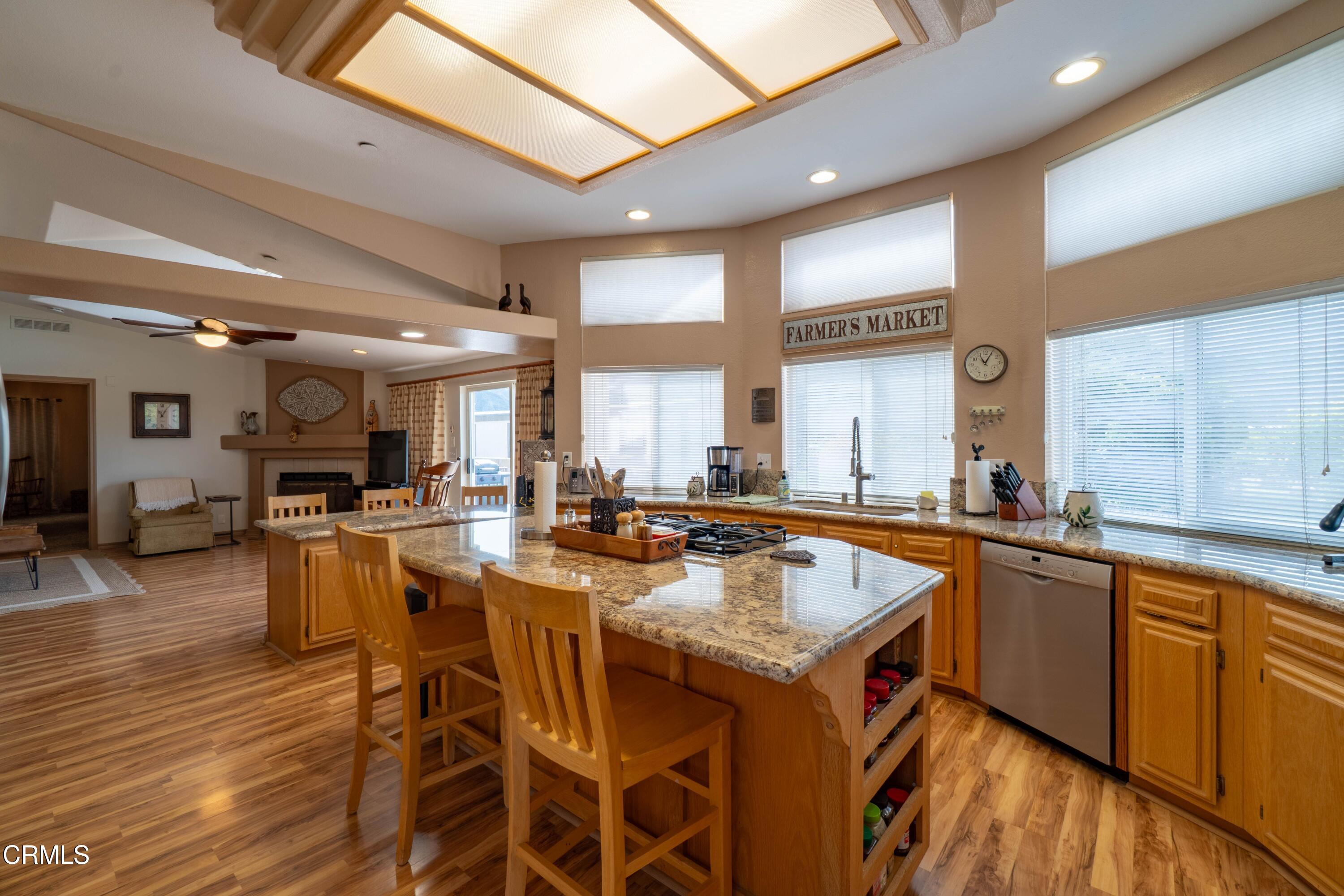 3760 Howe Road Fillmore, CA 93015 - Photo 12 of 32 a kitchen with a table chairs stove and cabinets