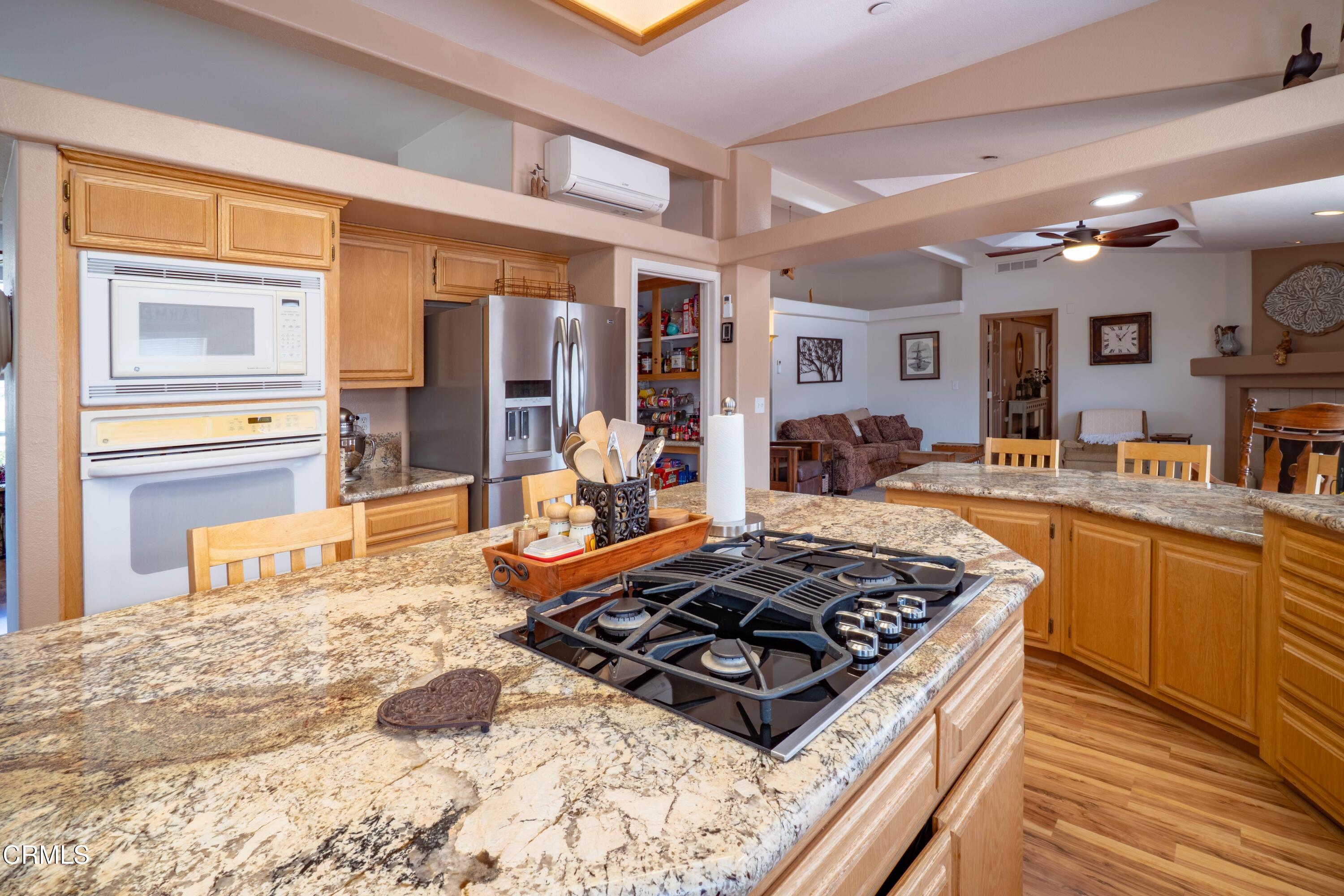 3760 Howe Road Fillmore, CA 93015 - Photo 13 of 32 a kitchen with stainless steel appliances granite countertop a stove and a sink