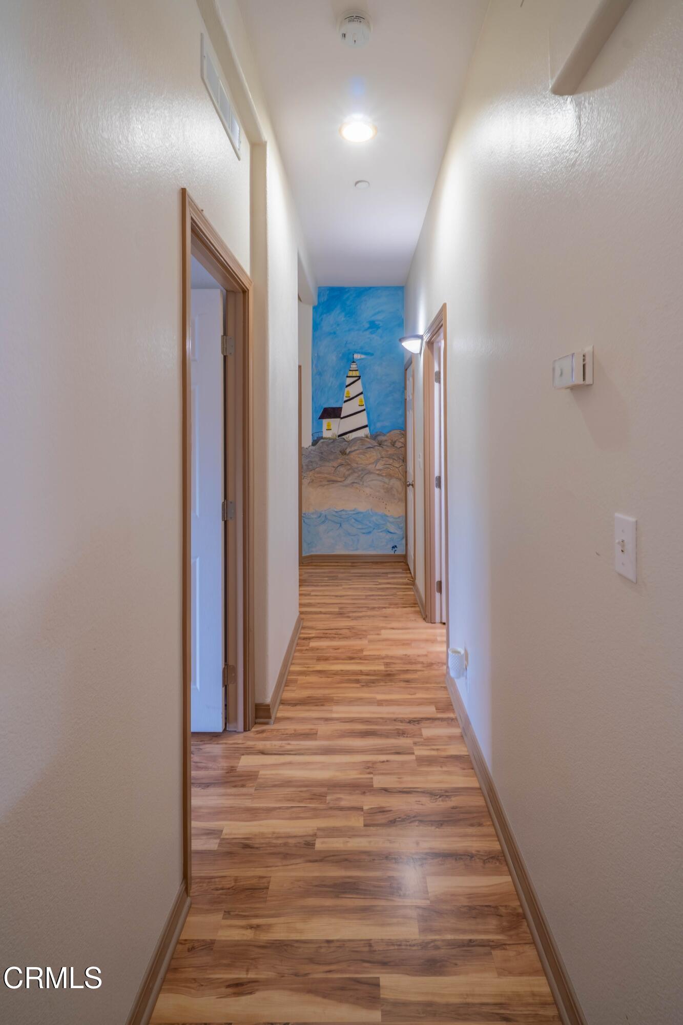 3760 Howe Road Fillmore, CA 93015 - Photo 18 of 32 a view of a hallway with wooden floor