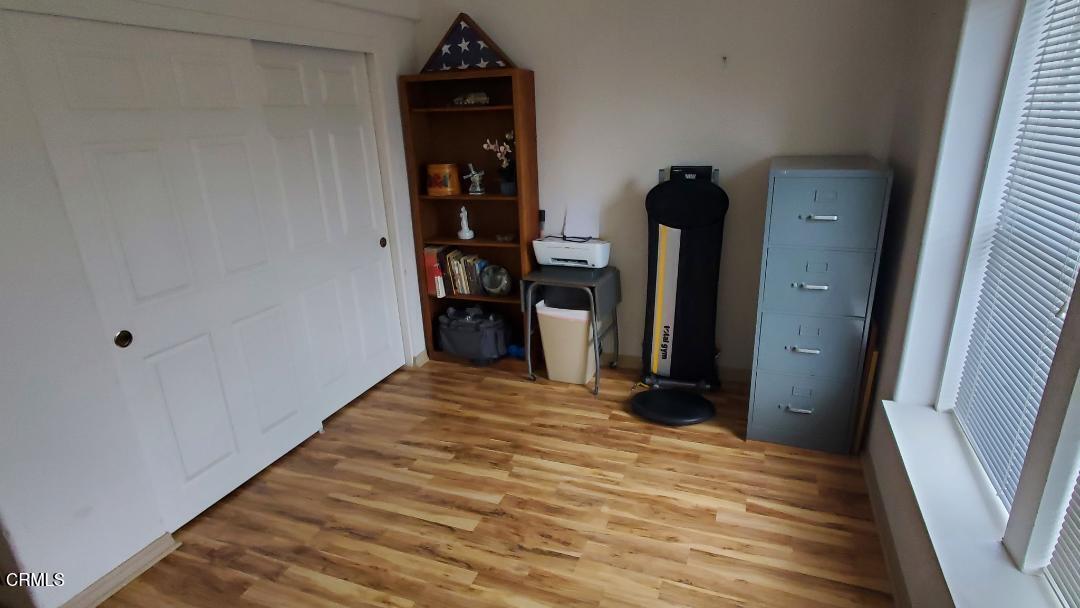 3760 Howe Road Fillmore, CA 93015 - Photo 20 of 32 a view of a hallway with wooden floor and staircase