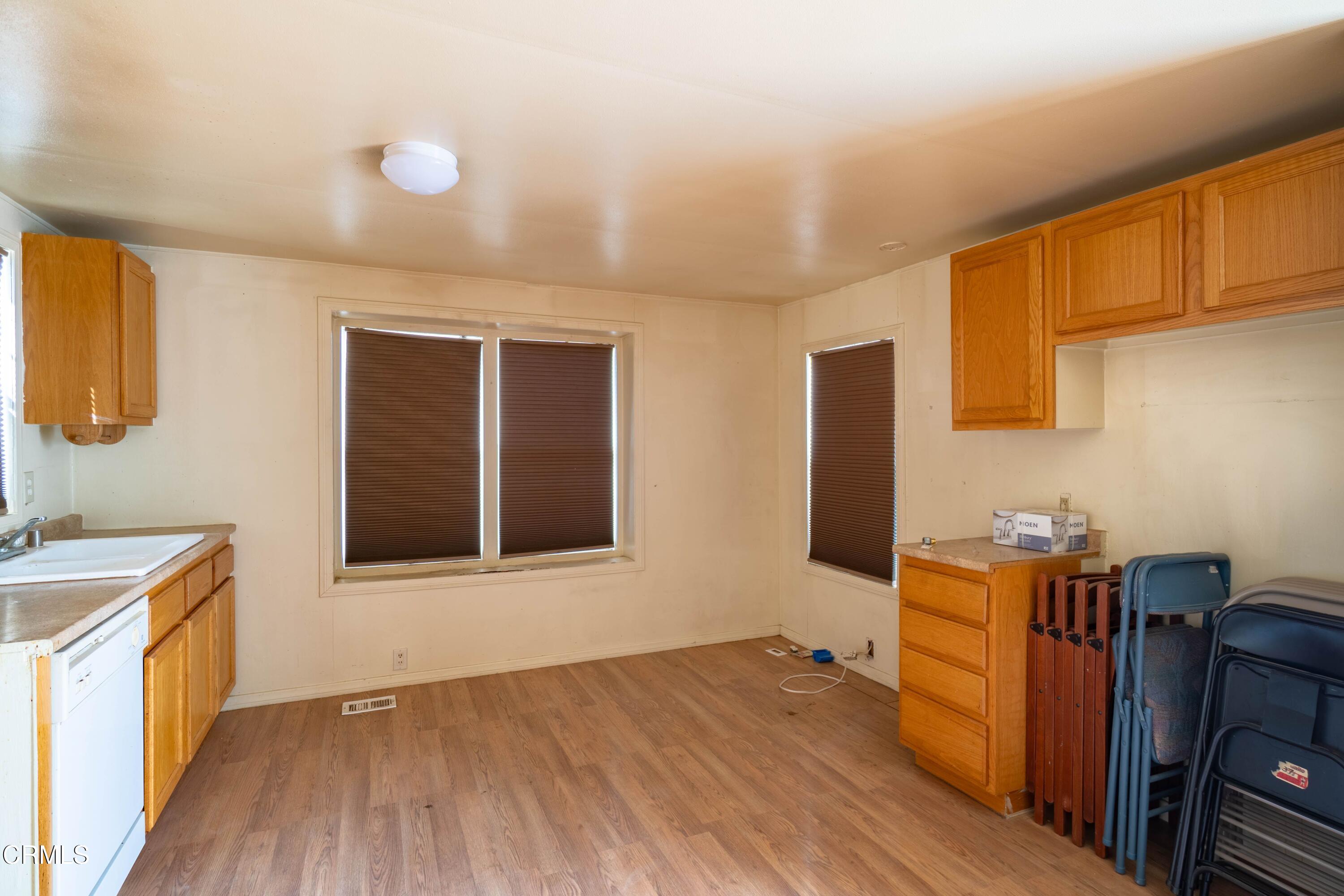 3760 Howe Road Fillmore, CA 93015 - Photo 30 of 32 a view of a kitchen with wooden floor and electronic appliances
