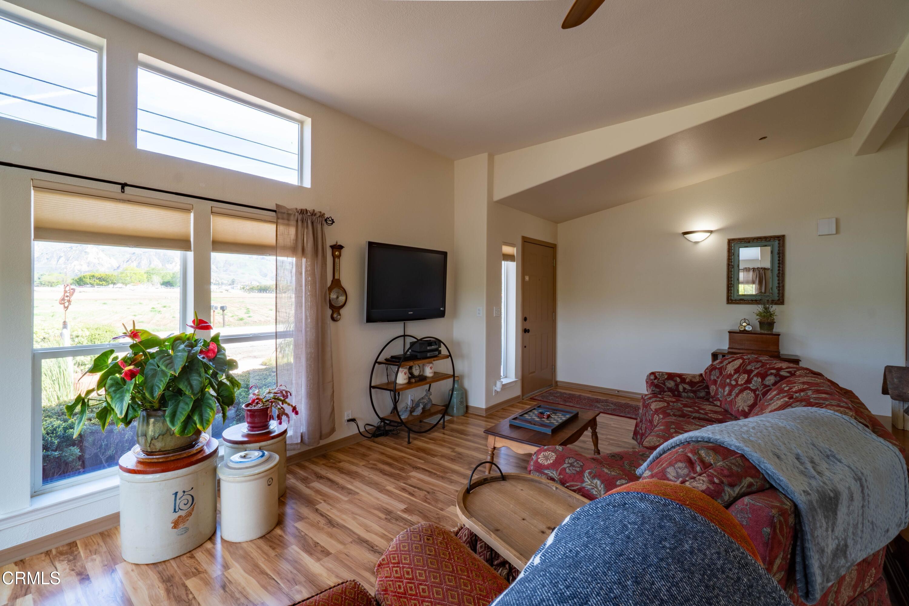 3760 Howe Road Fillmore, CA 93015 - Photo 9 of 32 a living room with furniture potted plant and a window