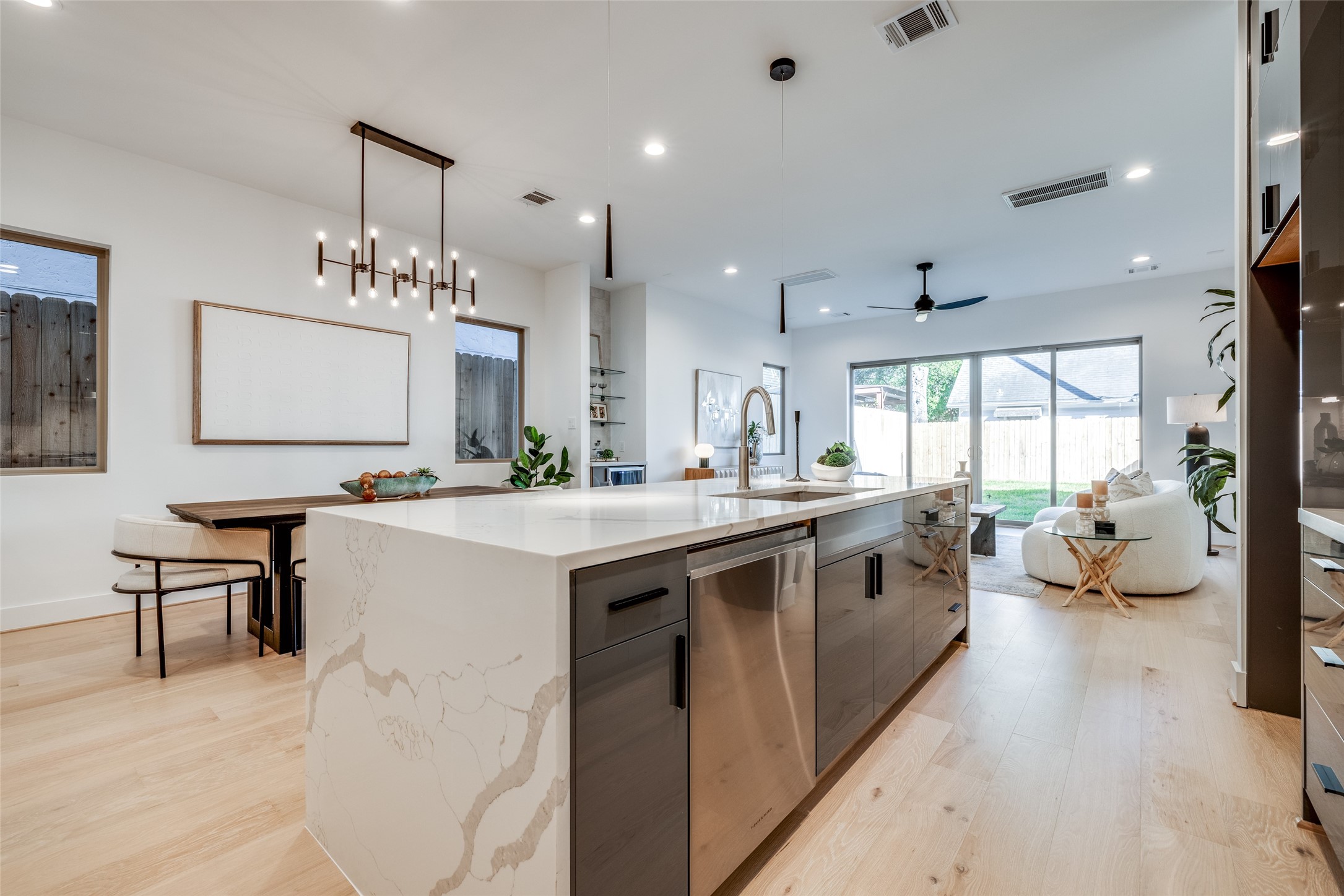 2410 Quenby Street Houston, TX 77005 - Photo 14 of 42 a large white kitchen with a large window