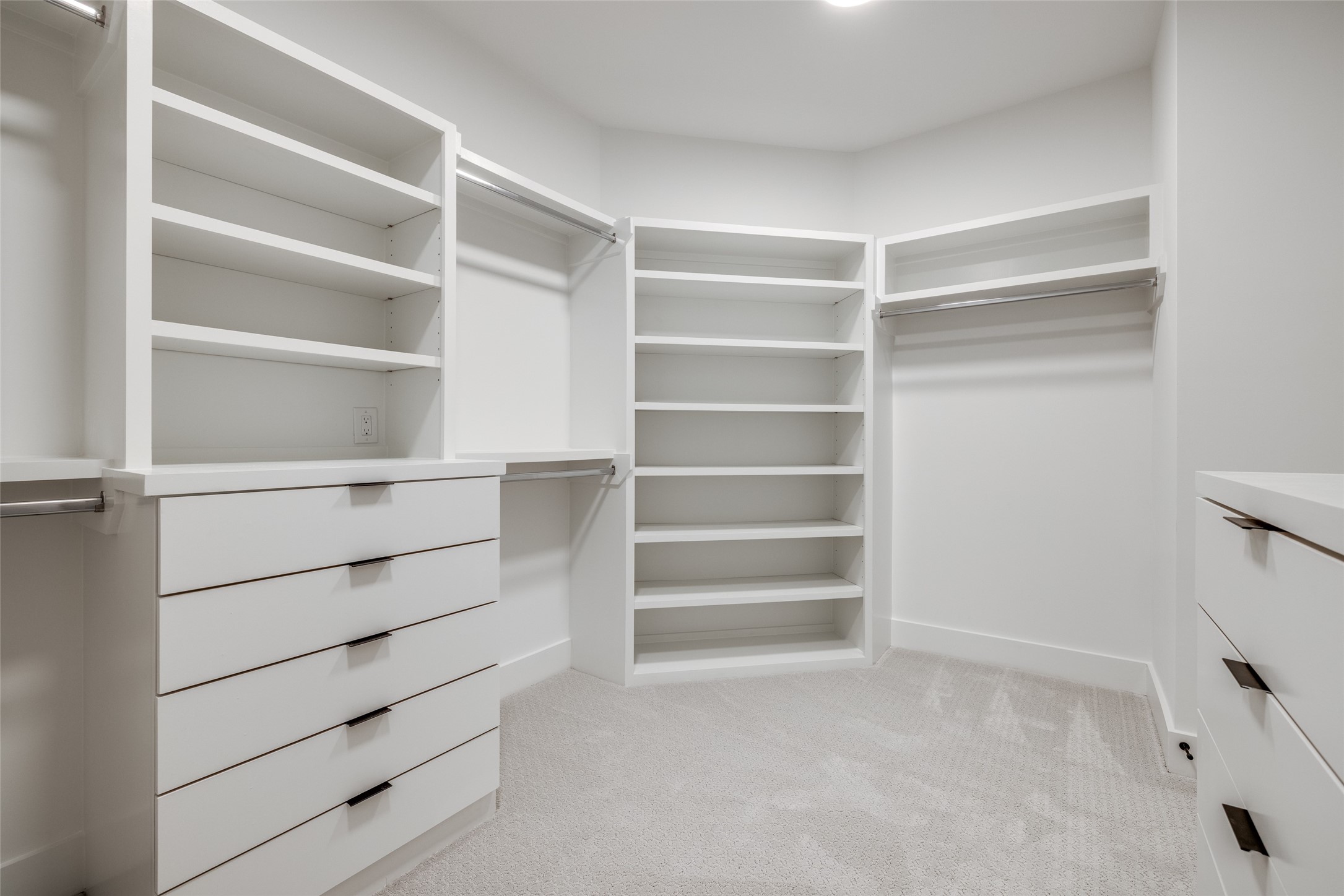 2410 Quenby Street Houston, TX 77005 - Photo 26 of 37 a view of walk in closet with empty racks