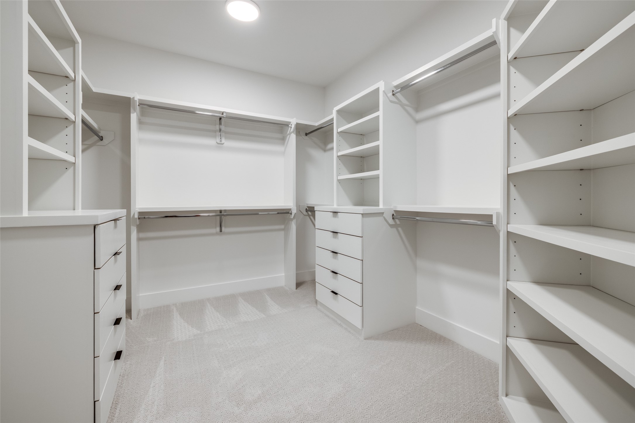 2410 Quenby Street Houston, TX 77005 - Photo 26 of 42 a view of walk in closet with empty racks