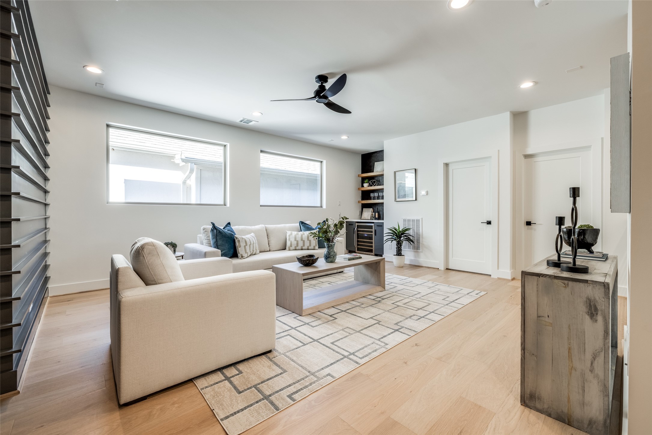 2410 Quenby Street Houston, TX 77005 - Photo 33 of 37 a living room with furniture and a flat screen tv