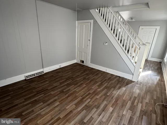 a view of entryway with wooden floor
