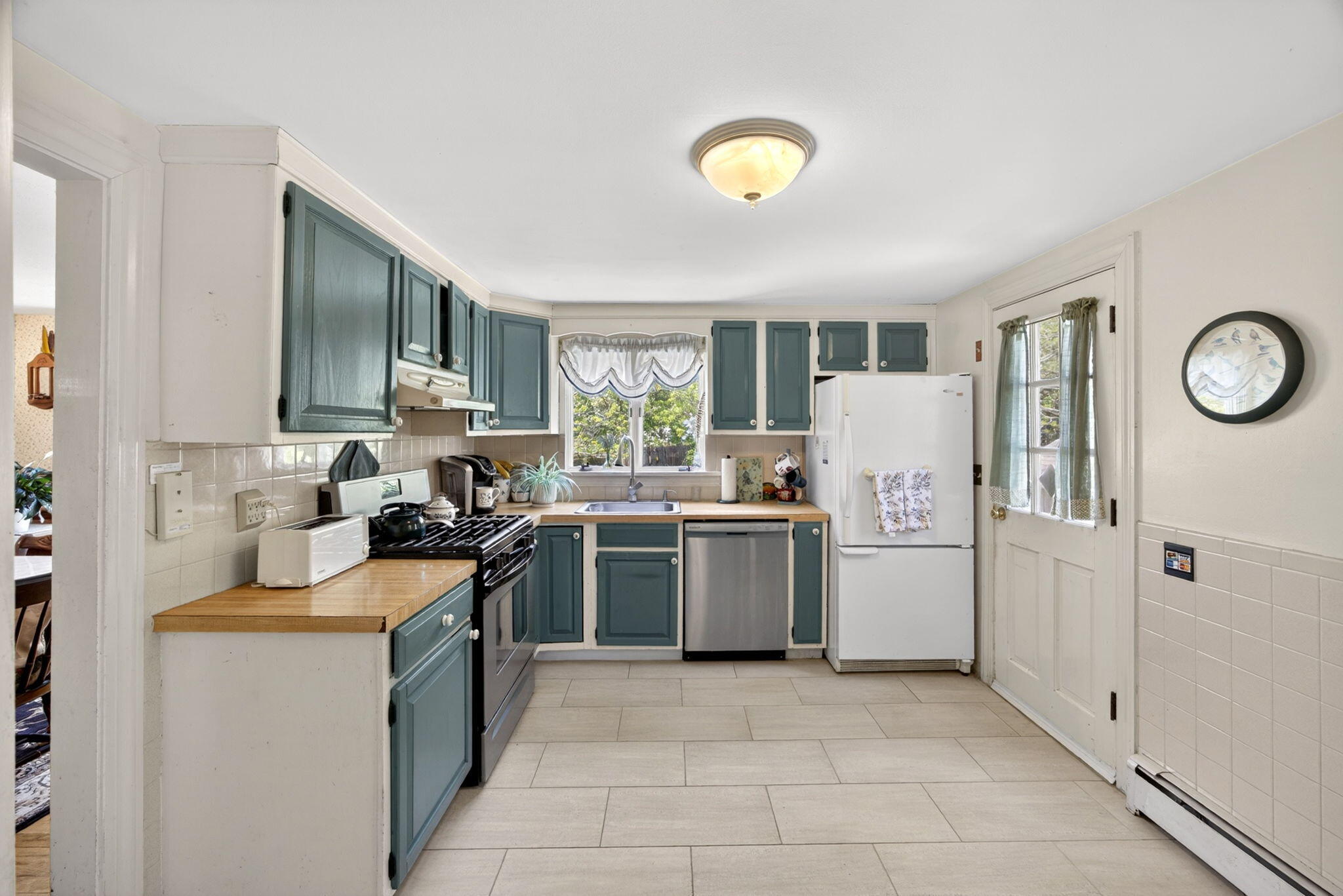 23 Nickerson Road Orleans, MA 02653 - Photo 3 of 54 a kitchen with a refrigerator stove and sink
