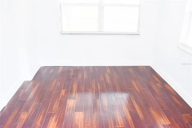 a view of a small space with wooden floor