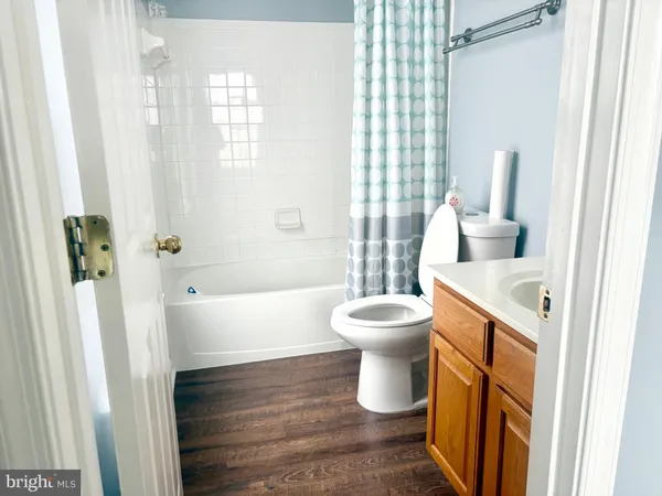 a bathroom with a toilet and a sink