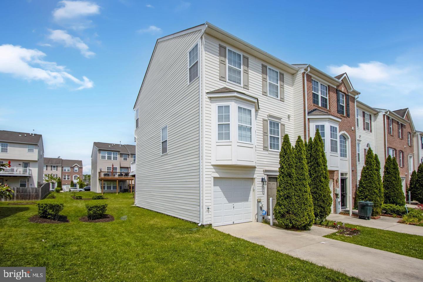 927 Tipton Road Baltimore, MD 21220 - Photo 2 of 21 a front view of a house with a yard