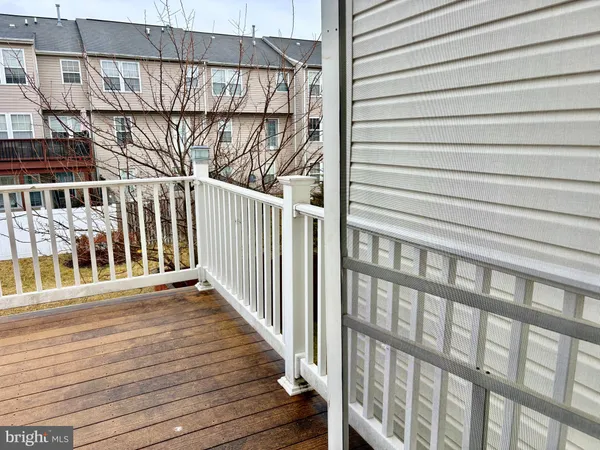a view of a balcony with wooden floor