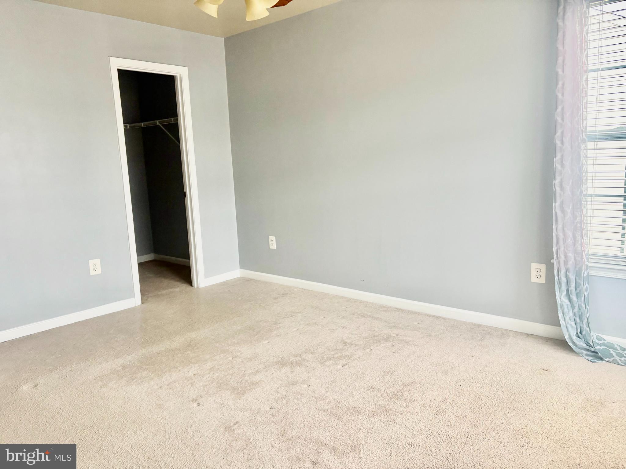 927 Tipton Road Baltimore, MD 21220 - Photo 8 of 21 an empty room with closet and windows