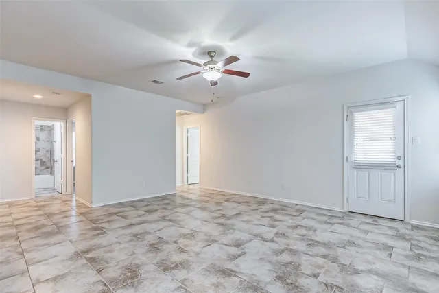 a view of an empty room and window