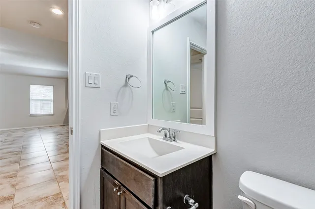 a bathroom with a sink and a toilet
