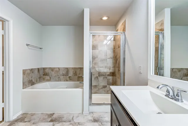 a bathroom with a bathtub and a sink
