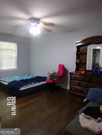 a bedroom with a bed and a table in it