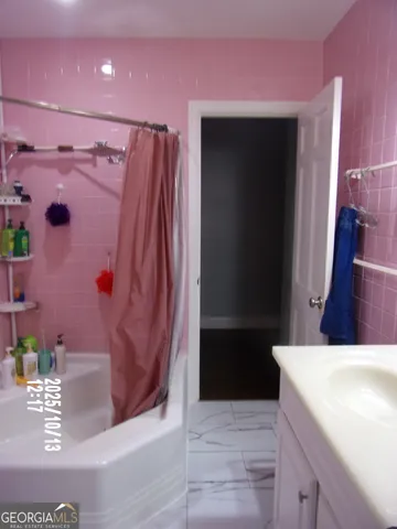 a bed sitting in a bedroom and closet