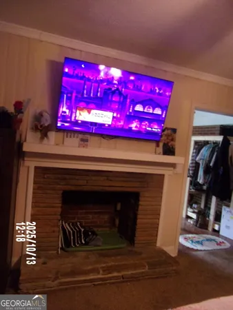 a living room with furniture a window and a fireplace