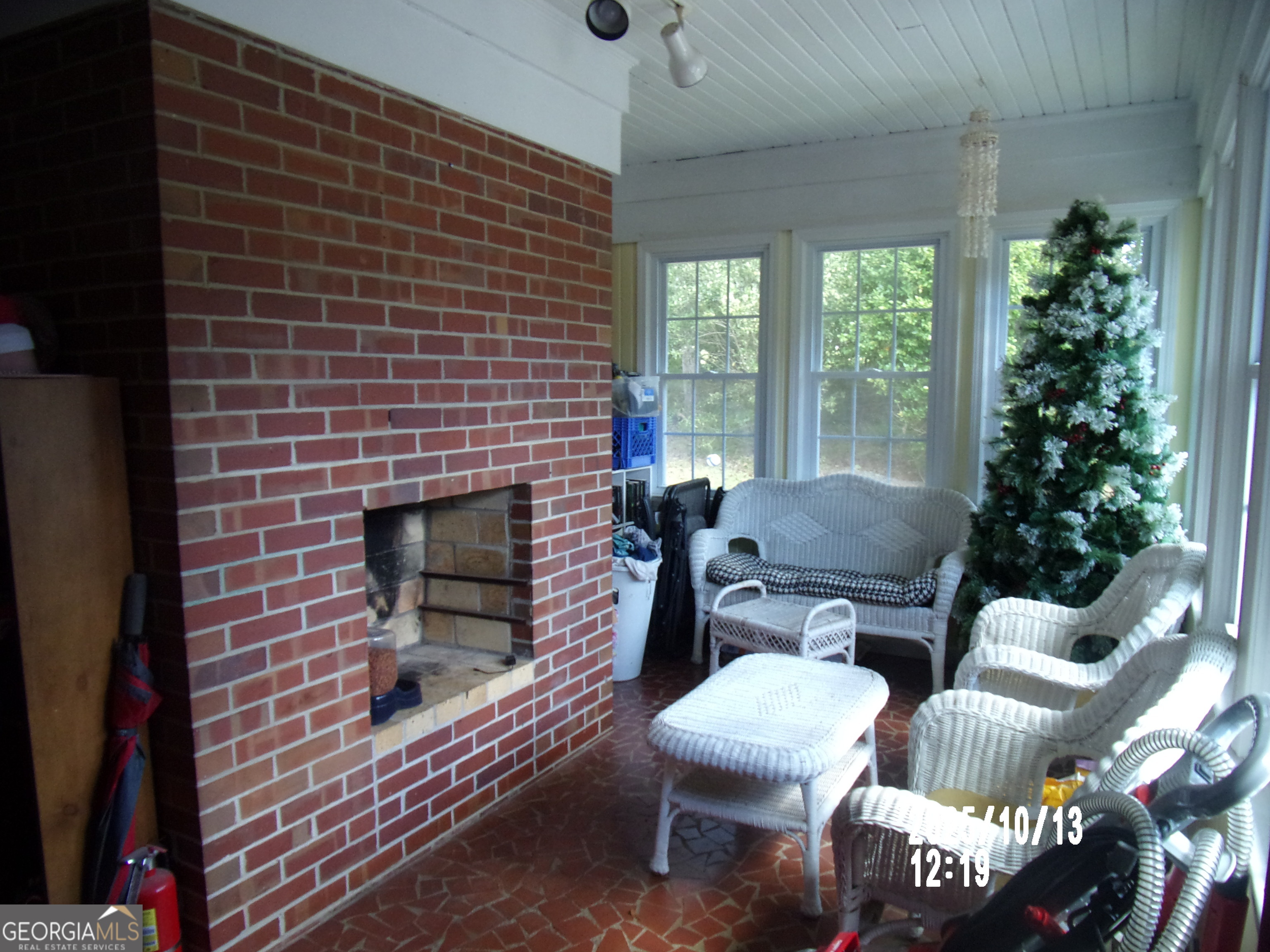 133 Springdale Drive Thomaston, GA 30286 - Photo 25 of 40 a living room with furniture a window and a fireplace