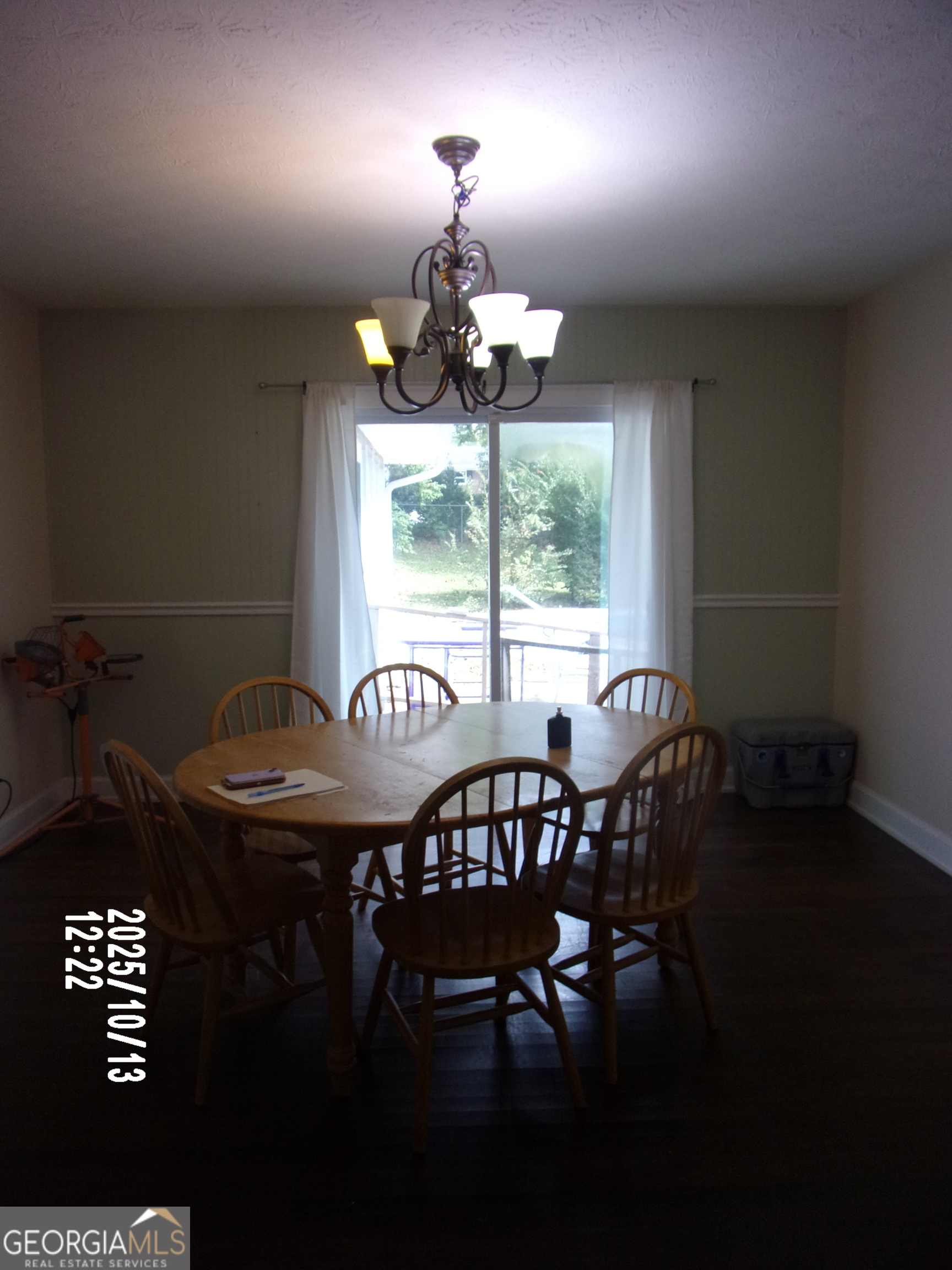 133 Springdale Drive Thomaston, GA 30286 - Photo 32 of 40 a view of a dining room with furniture wooden floor and chandelier