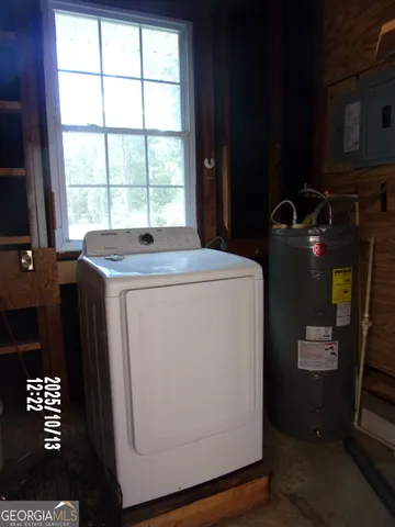 a backyard of a house with a yard and outdoor seating