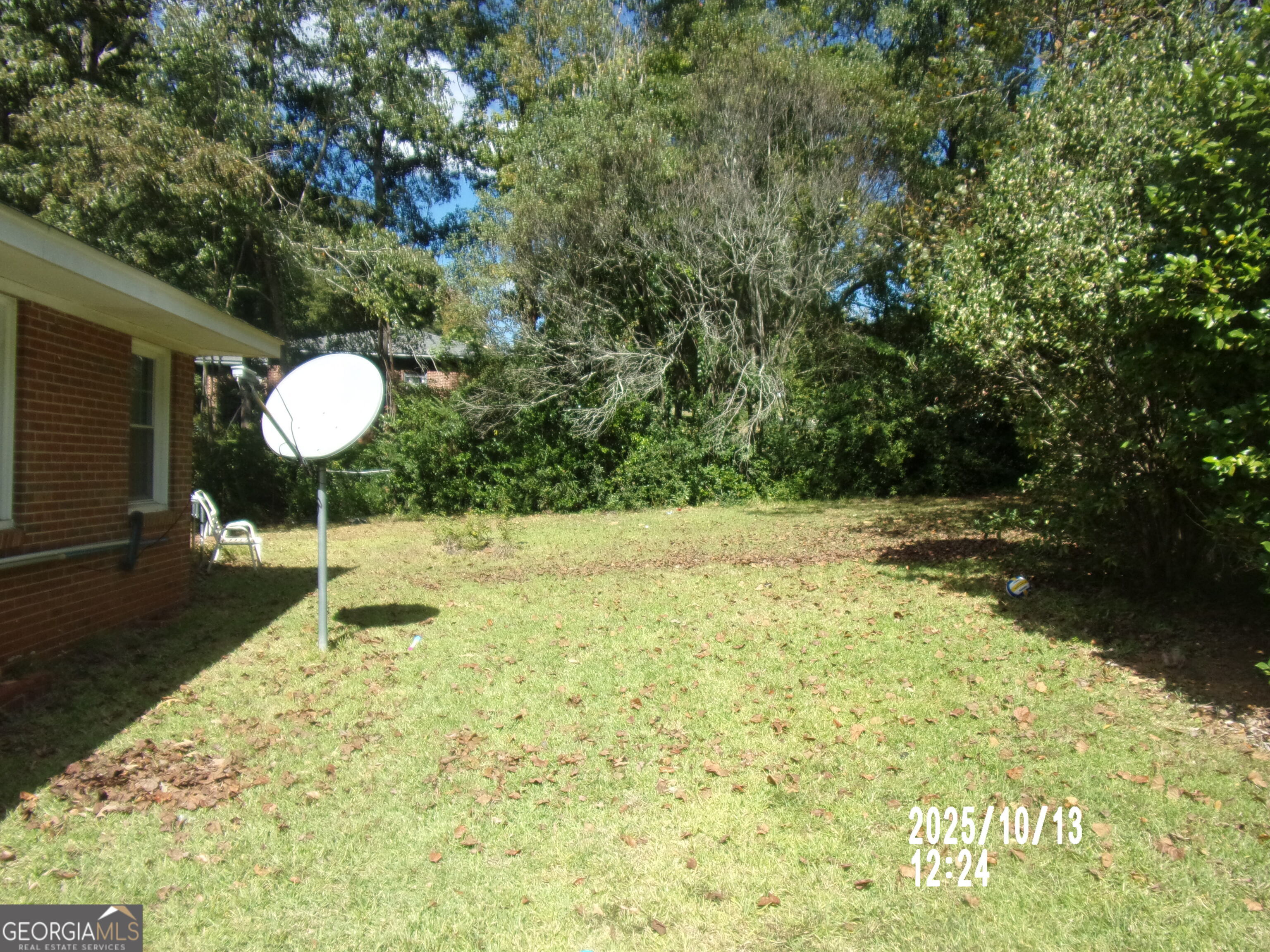 133 Springdale Drive Thomaston, GA 30286 - Photo 35 of 40 a backyard of a house with a yard and outdoor seating