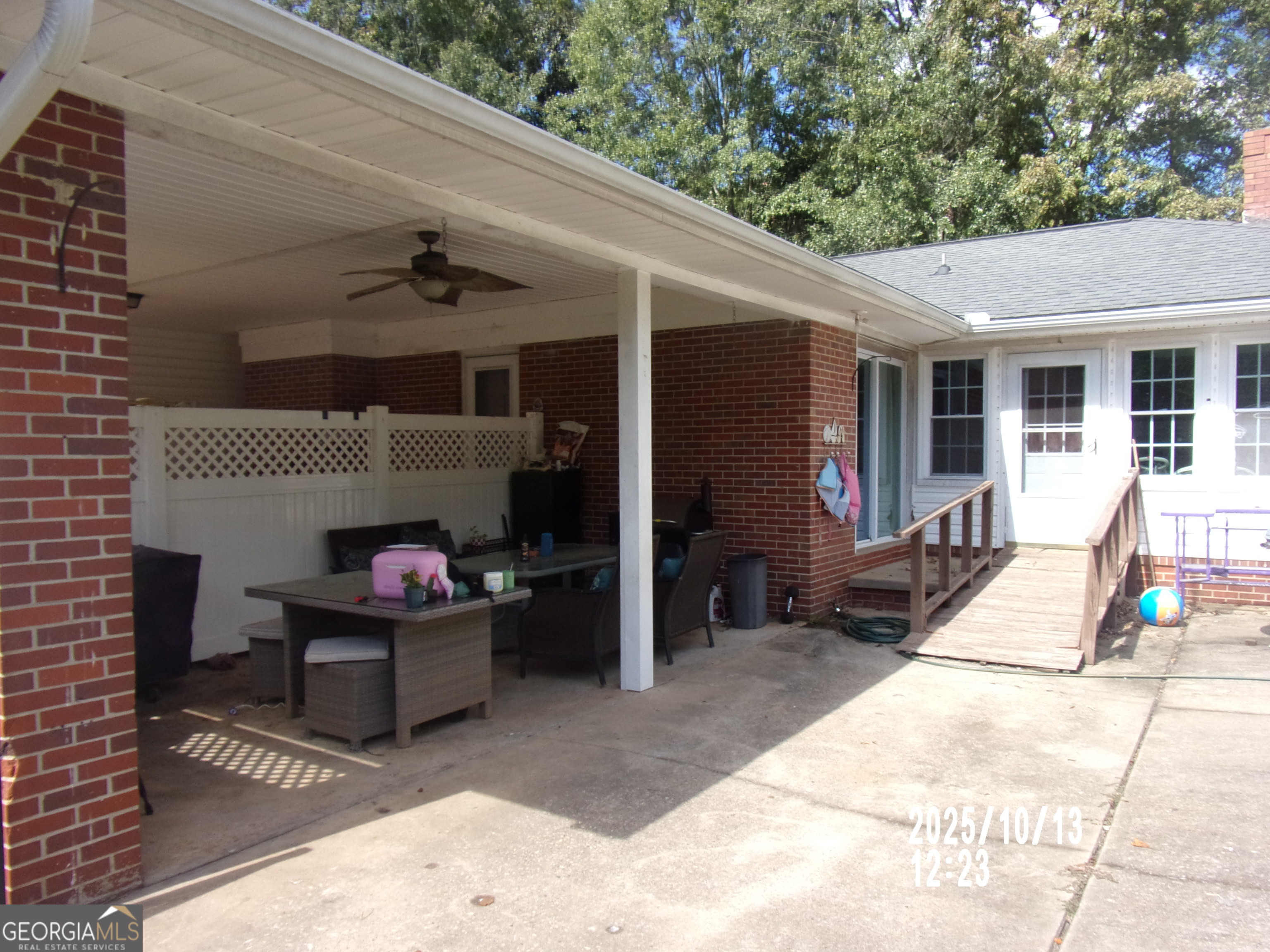 133 Springdale Drive Thomaston, GA 30286 - Photo 5 of 40 a view of a patio with table and chairs a barbeque