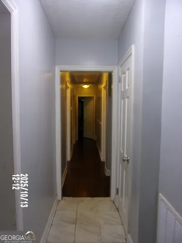 a bed room with a bed and a view of bedroom