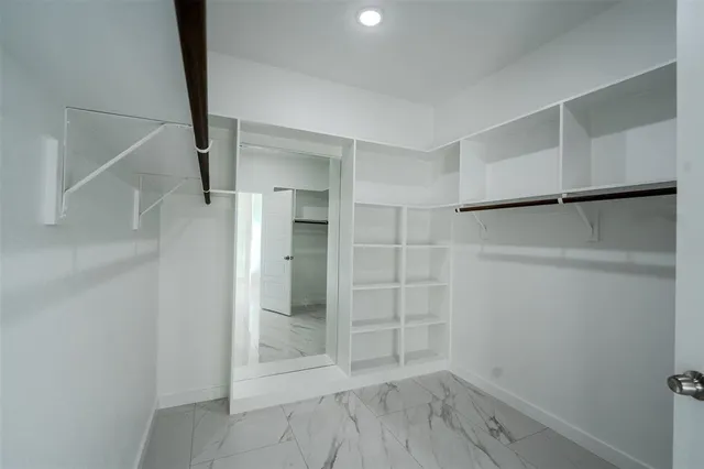 a view of an empty walk in closet