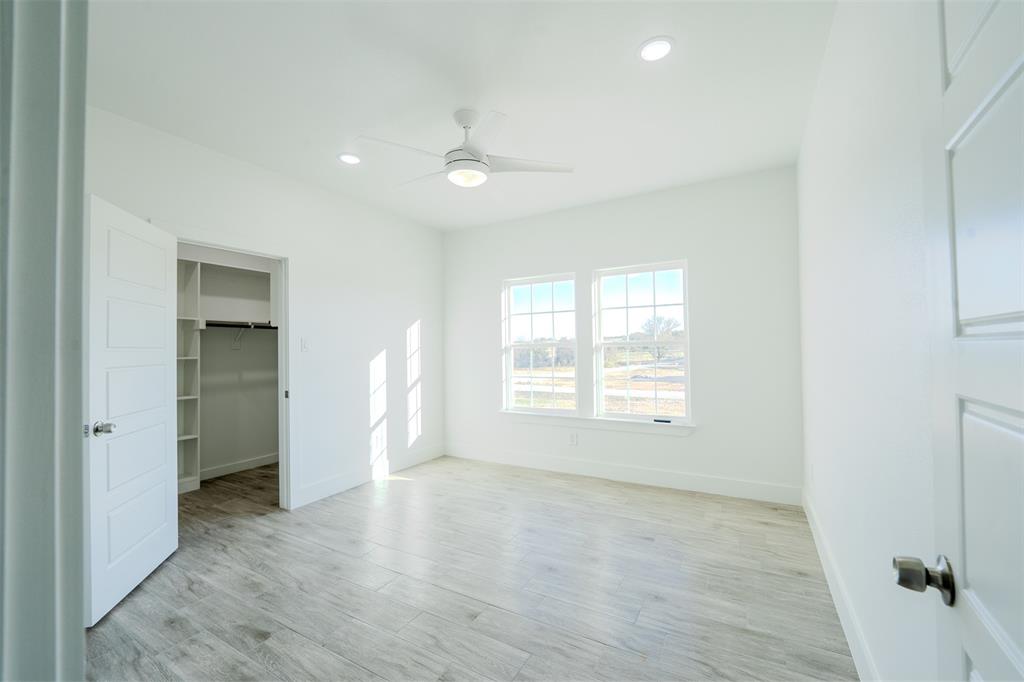 200 Kilkenny Road Poolville, TX 76487 - Photo 22 of 36 wooden floor in an empty room with a window
