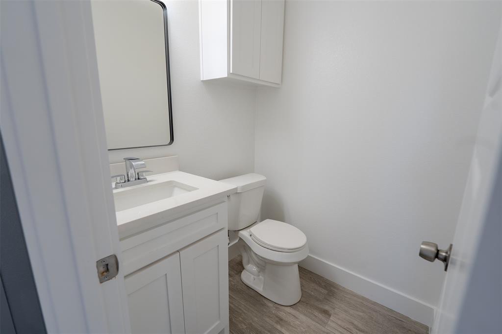 200 Kilkenny Road Poolville, TX 76487 - Photo 29 of 36 a bathroom with a sink toilet and a mirror