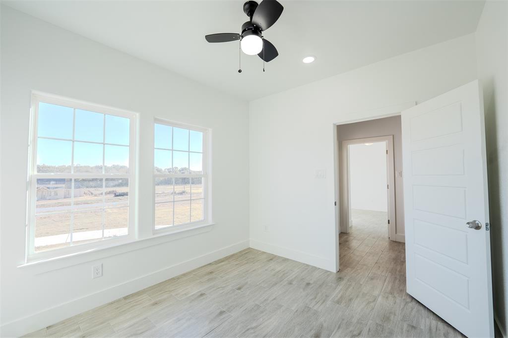 200 Kilkenny Road Poolville, TX 76487 - Photo 10 of 36 a view of an empty room with a window