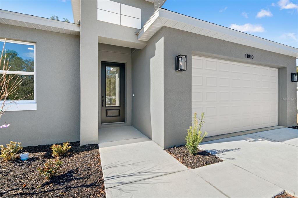 11810 North Providence Way Citrus Springs, FL 34433 - Photo 2 of 53 a front view of a house