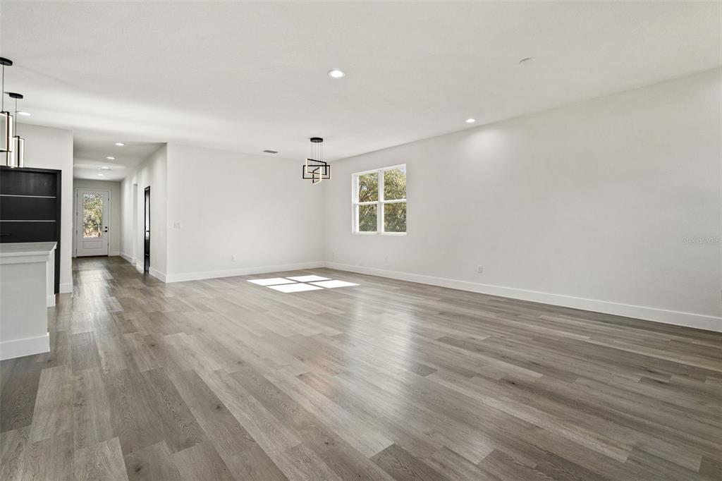 11810 North Providence Way Citrus Springs, FL 34433 - Photo 24 of 53 an empty room with wooden floor and a window