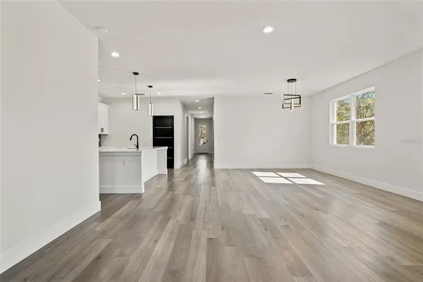a view of hallway with wooden floor