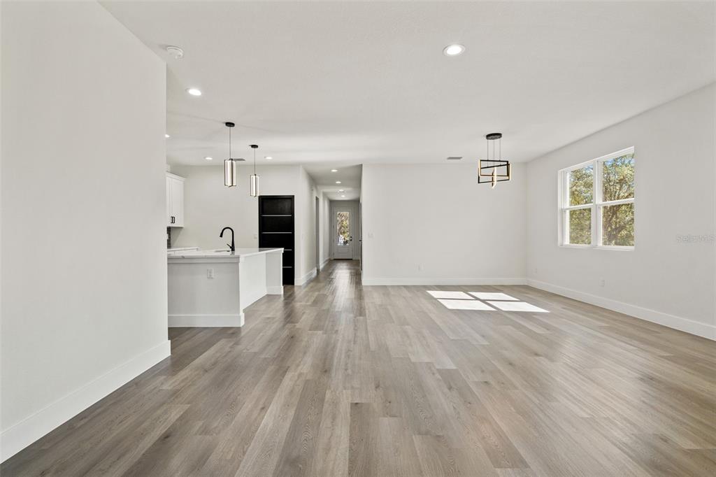 11810 North Providence Way Citrus Springs, FL 34433 - Photo 25 of 53 a view of a kitchen with wooden floor and a window