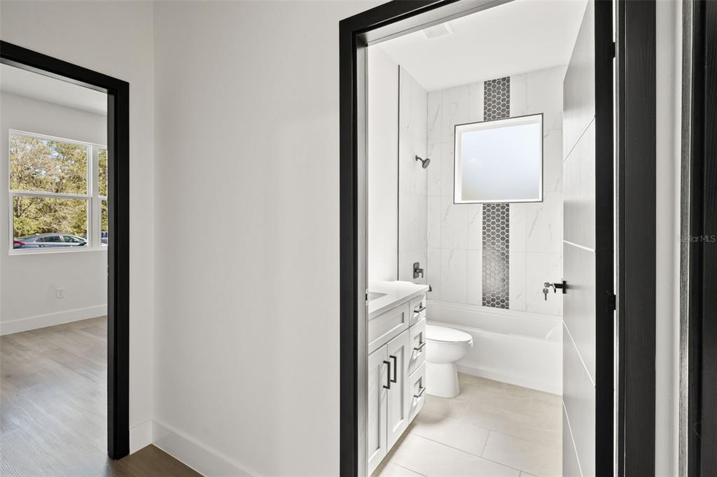 11810 North Providence Way Citrus Springs, FL 34433 - Photo 28 of 53 a bathroom with a toilet sink and a mirror