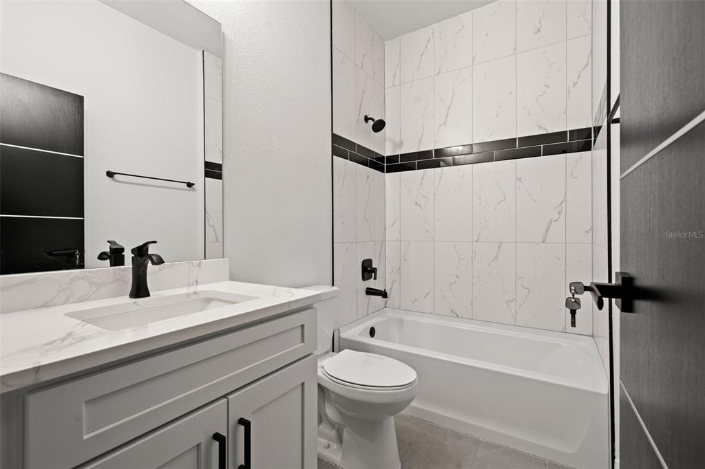 11810 North Providence Way Citrus Springs, FL 34433 - Photo 30 of 53 a bathroom with a sink toilet and shower