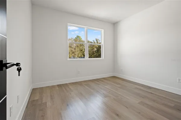 a bedroom with a large bed and a couch